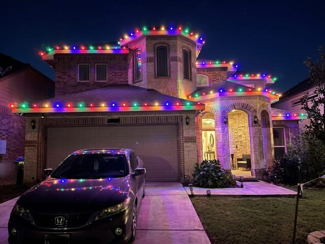 Multicolor roofline on stone home